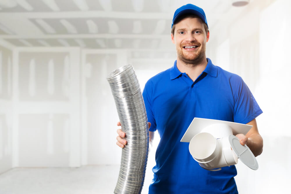A-Z Air Duct. Man holding HVAC piping