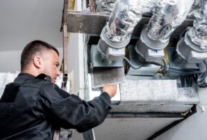 Air Duct Cleaning Services. Man performing Air duct cleaning in gilbert AZ